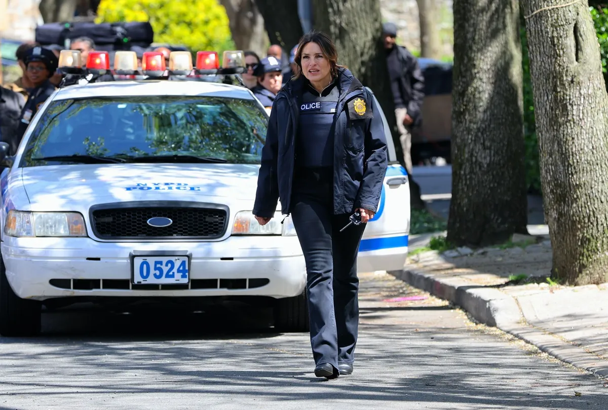 Mariska Hargitay walking in a 'Law & Order SVU' scene in a police uniform.