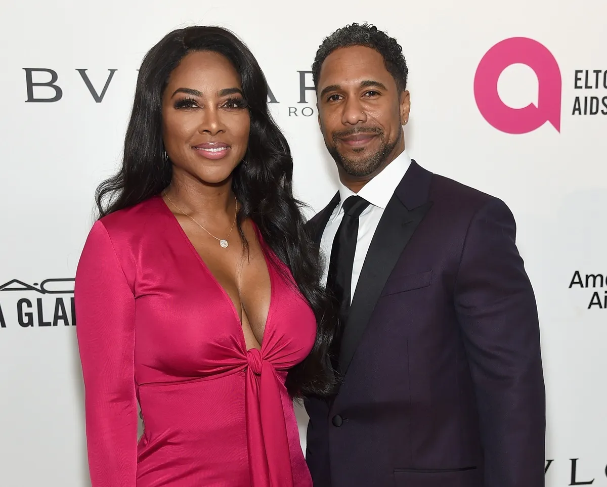 Kenya Moore and Marc Daly attend the 26th annual Elton John AIDS Foundation's Academy Awards Viewing Party at The City of West Hollywood Park on March 4, 2018 in West Hollywood, California