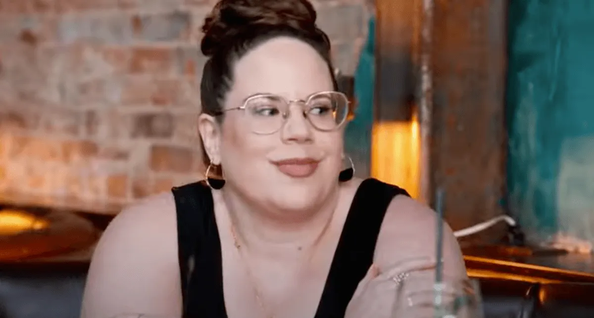 Whitney Way Thore in glasses and a black tank top in 'My Big Fat Fabulous Life'