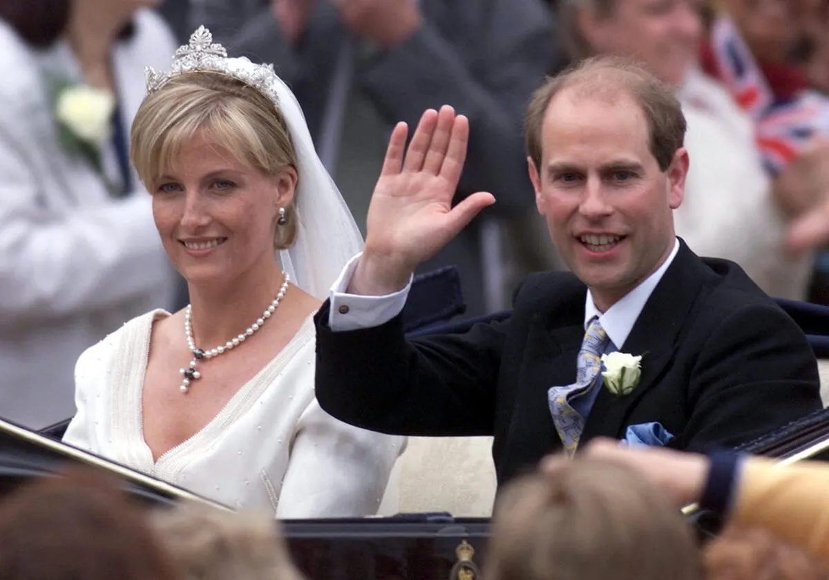 Prince Edward and his wife, Sophie (now-Duchess of Edinburgh) greet wellwishers from an open carriage following their wedding in St. George's Chapel
