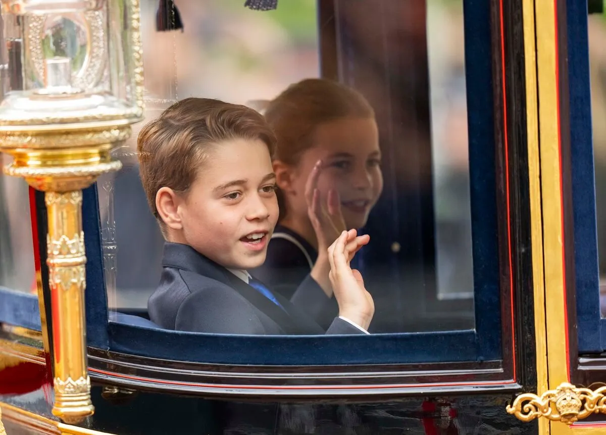 Prince George and Princess Charlotte wave from carriage during Trooping the Colour