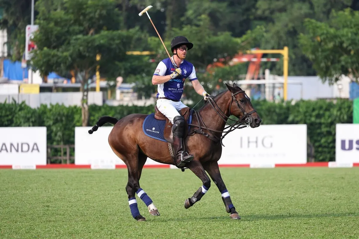 Prince Harry plays polo during the Sentebale ISPS Handa Polo Cup