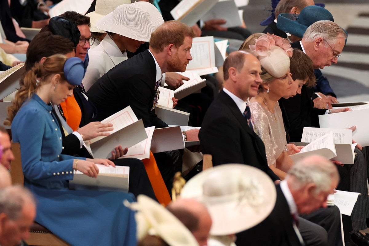 Prince Harry reacts as he leans forward while seated near Princess Beatrice and Princess Eugenie, and behind Prince Edward and Sophie during the service of thanksgiving for Queen Elizabeth II