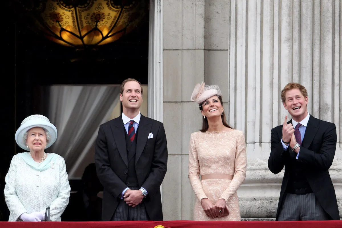 Prince Harry, who called 'distance' a royal life 'essential,' with Queen Elizabeth II, Prince William, and Kate Middleton standing on the Buckingham Palace Balcony