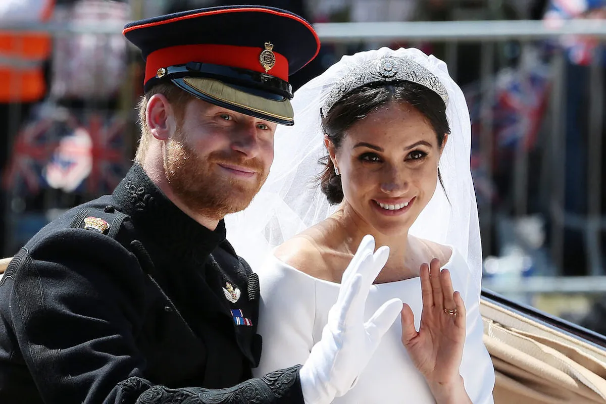 Prince Harry, whom Prince William made 'sick' the night before his wedding, with Meghan Markle on their royal wedding day during a carriage ride