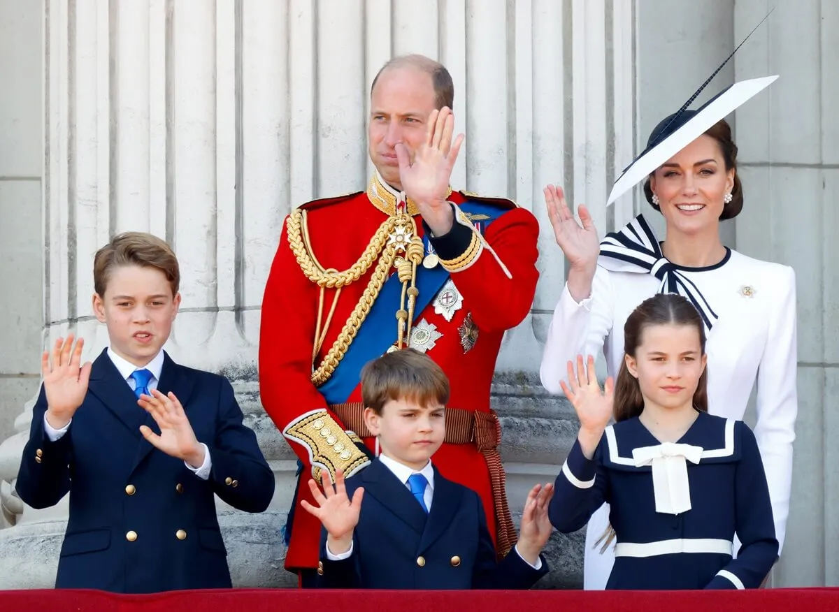 Prince William and Kate Middleton with their children watching a flypast from the balcony of Buckingham Palace 