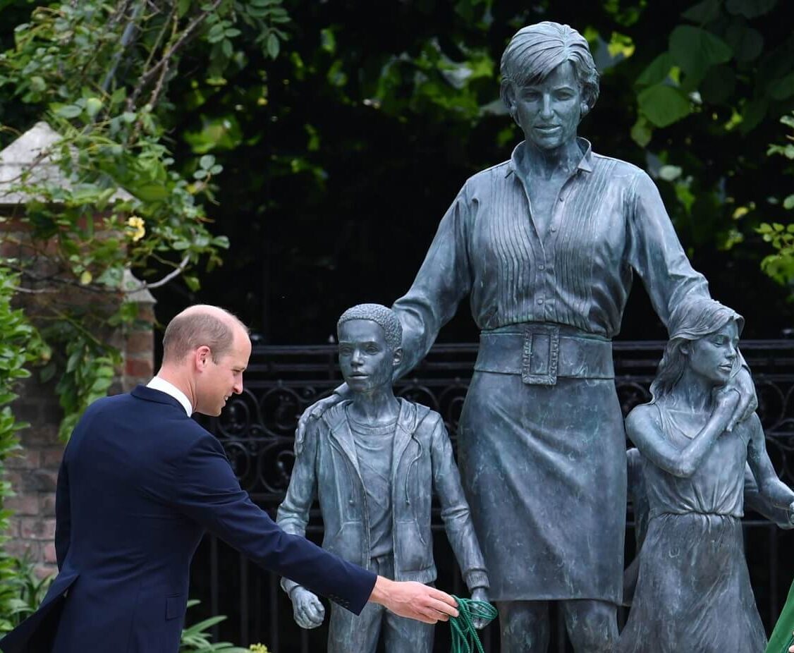 Prince William unveiling a statue of Princess Diana in the Sunken Garden at Kensington Palace