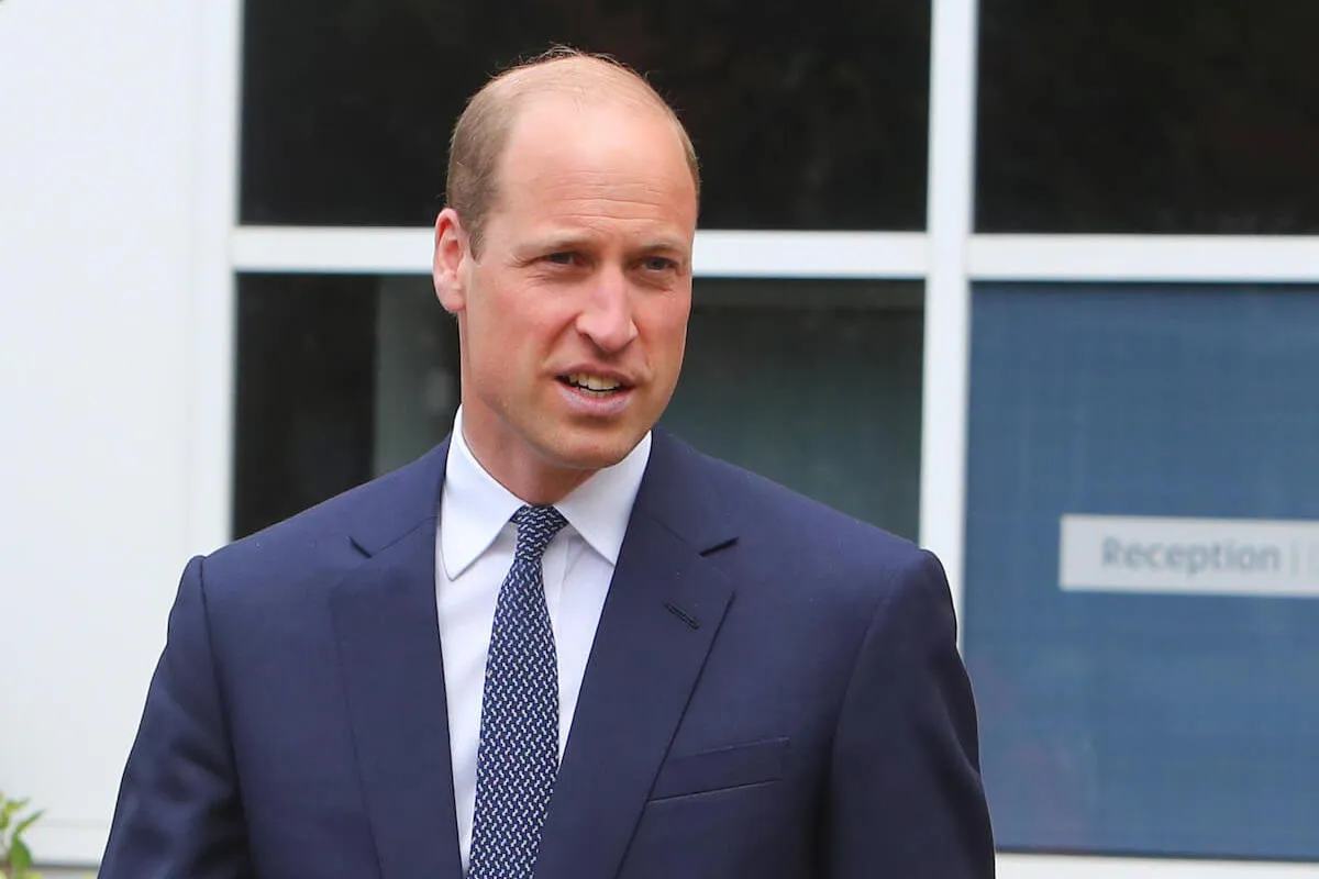 Prince William, who likes to listen to AC:DC's 'Thunderstruck,' looks on wearing a suit and tie