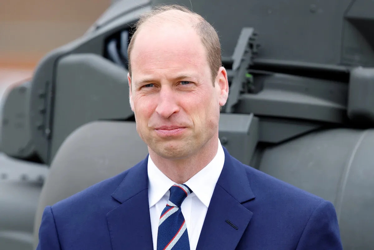 Prince William, whose 'inner circle' without Prince Harry includes Mike Tindall and Peter Phillips as 'replacement brothers,' in May 2024 wearing a navy suit.