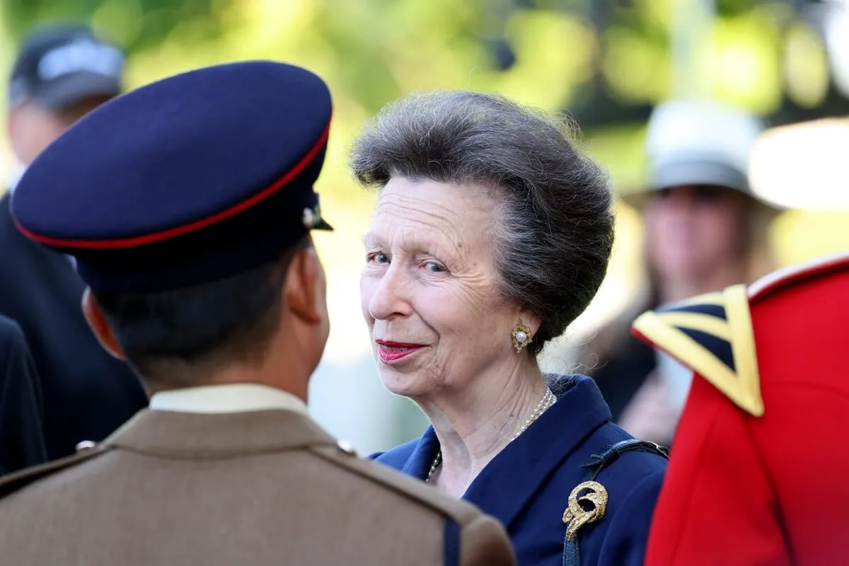 Princess Anne speaks with soldiers during a Royal British Legion service of commemoration at the Bayeux War Cemetery in Normandy, France