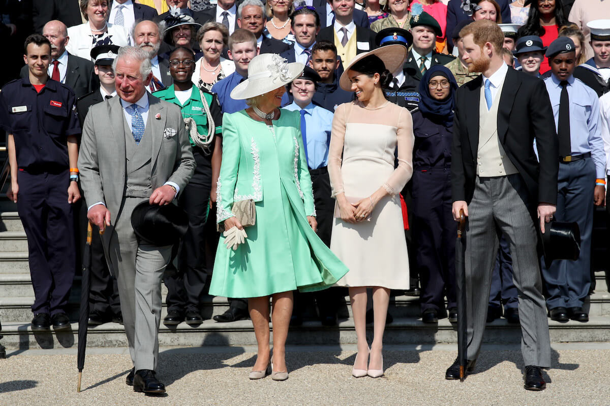 Queen Camilla, whom a royal photographer says they showed a photo of newborn baby Prince Archie, with King Charles, Meghan Markle, and Prince Harry in 2018