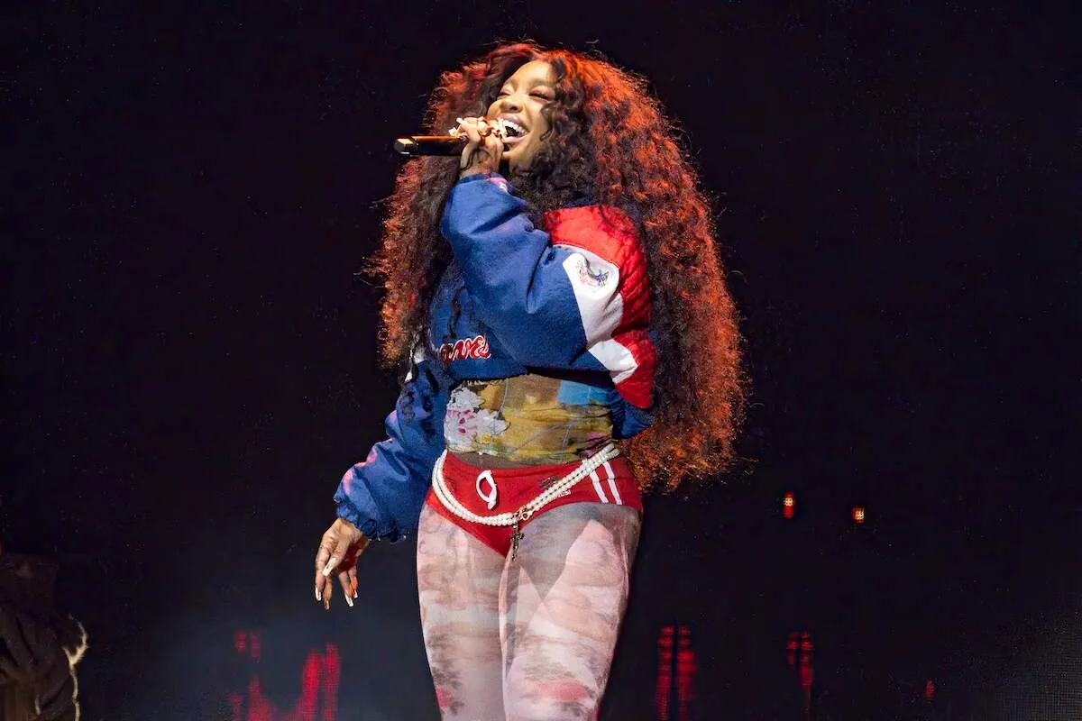 Wear a blue and red jacket, SZA performs during the 2024 Dreamville Music Festival