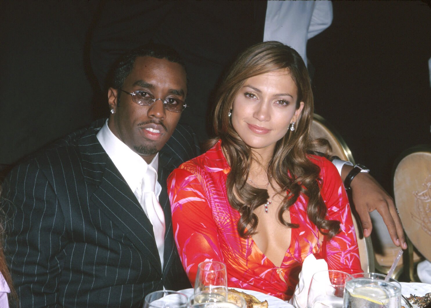 Sean 'P. Diddy' Combs and Jennifer Lopez sitting next to each other at the 42nd Grammy Awards