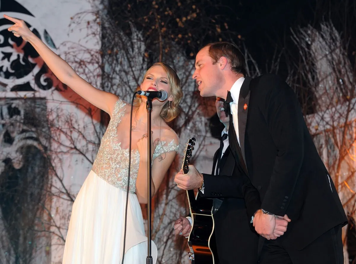 Taylor Swift and Prince William perform with Jon Bon Jovi during the Winter Whites Gala In Aid Of Centrepoint in London, England