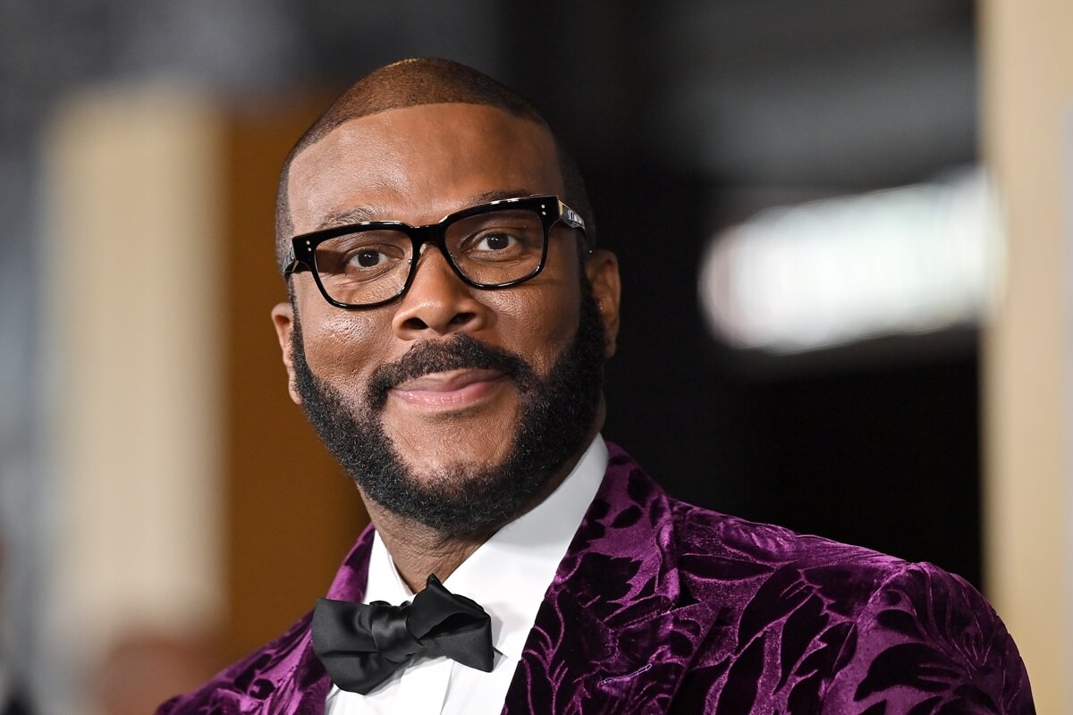 Tyler Perry attending Marvel Studios' "Black Panther 2: Wakanda Forever" in a purple suit.