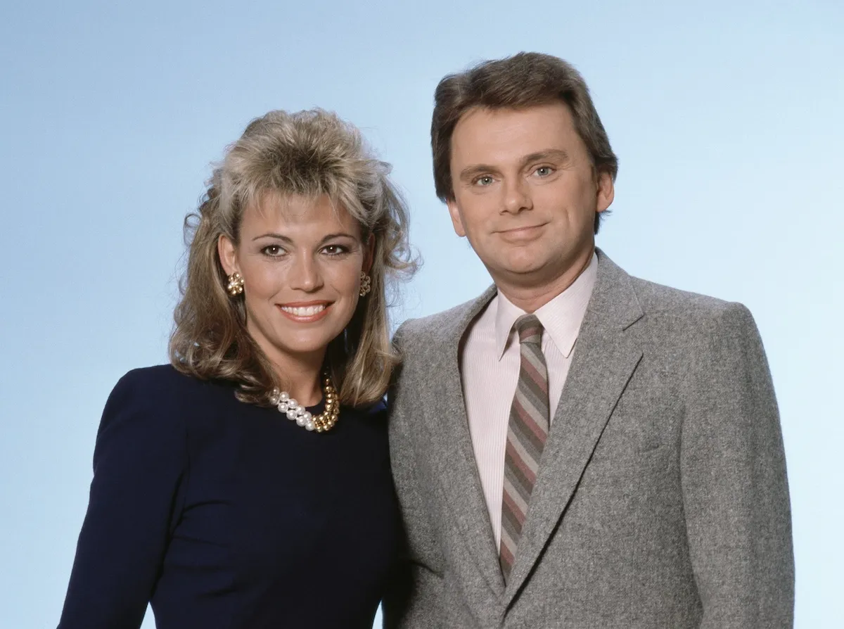 Portrait of 'Wheel of Fortune' host Pat Sajak with Vanna White in the 1980s