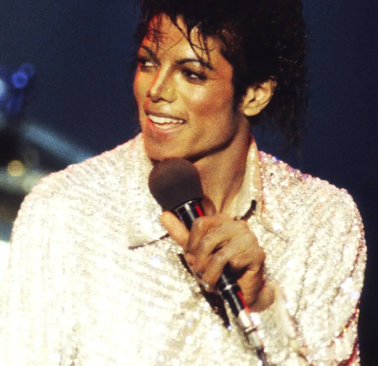 'Off the Wall' star Michael Jackson with a microphone