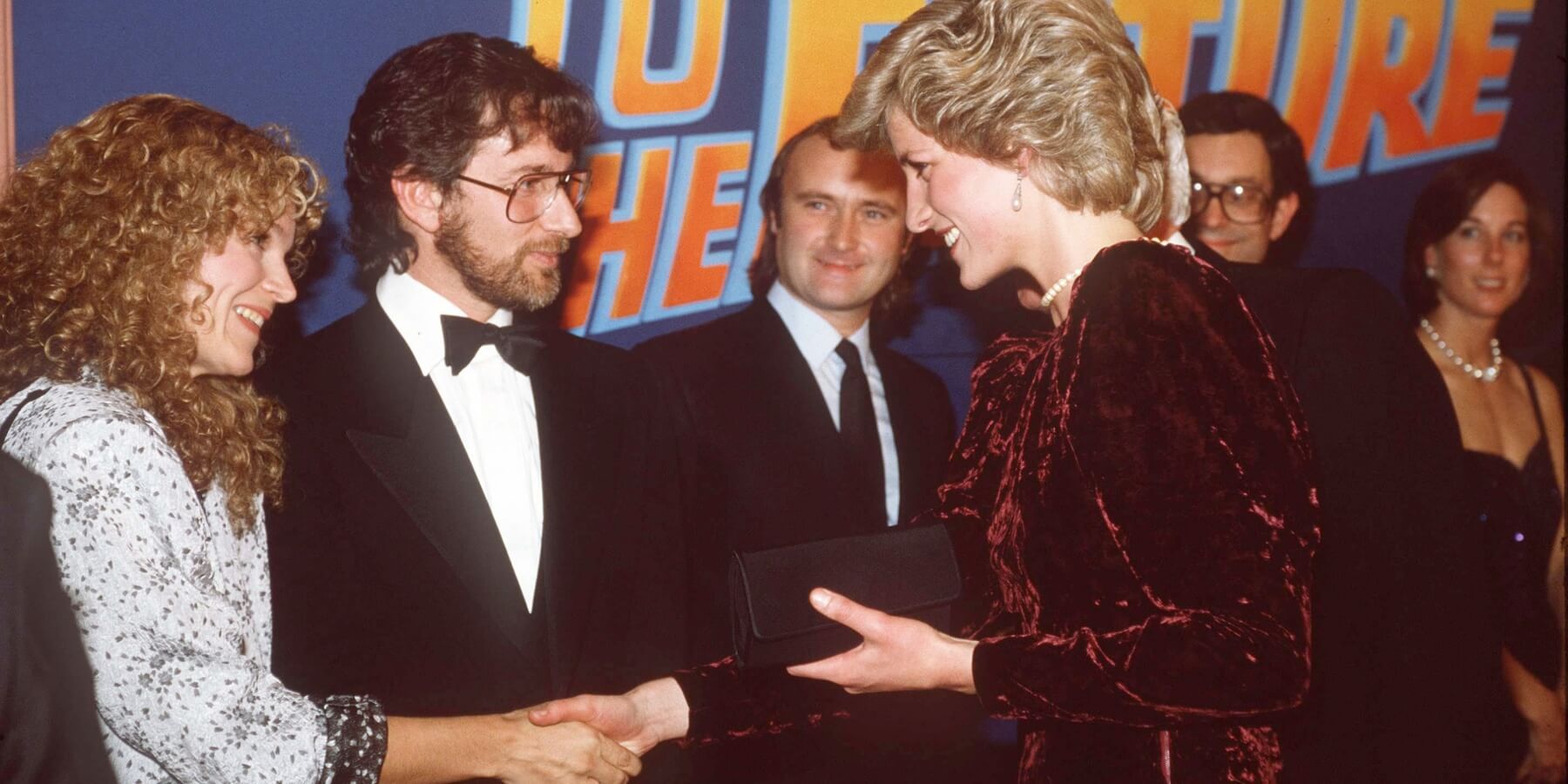 Princess Diana wore a long strand of pearls down her back, styled by Richard Eden, for the 'Back to the Future' premiere in 1985