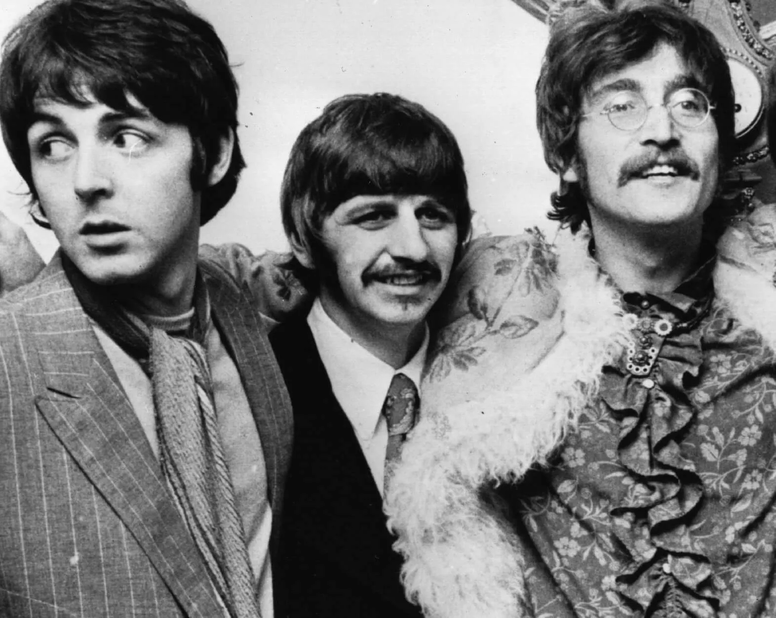 The Beatles' Paul McCartney, Ringo Starr, and John Lennon in black-and-white