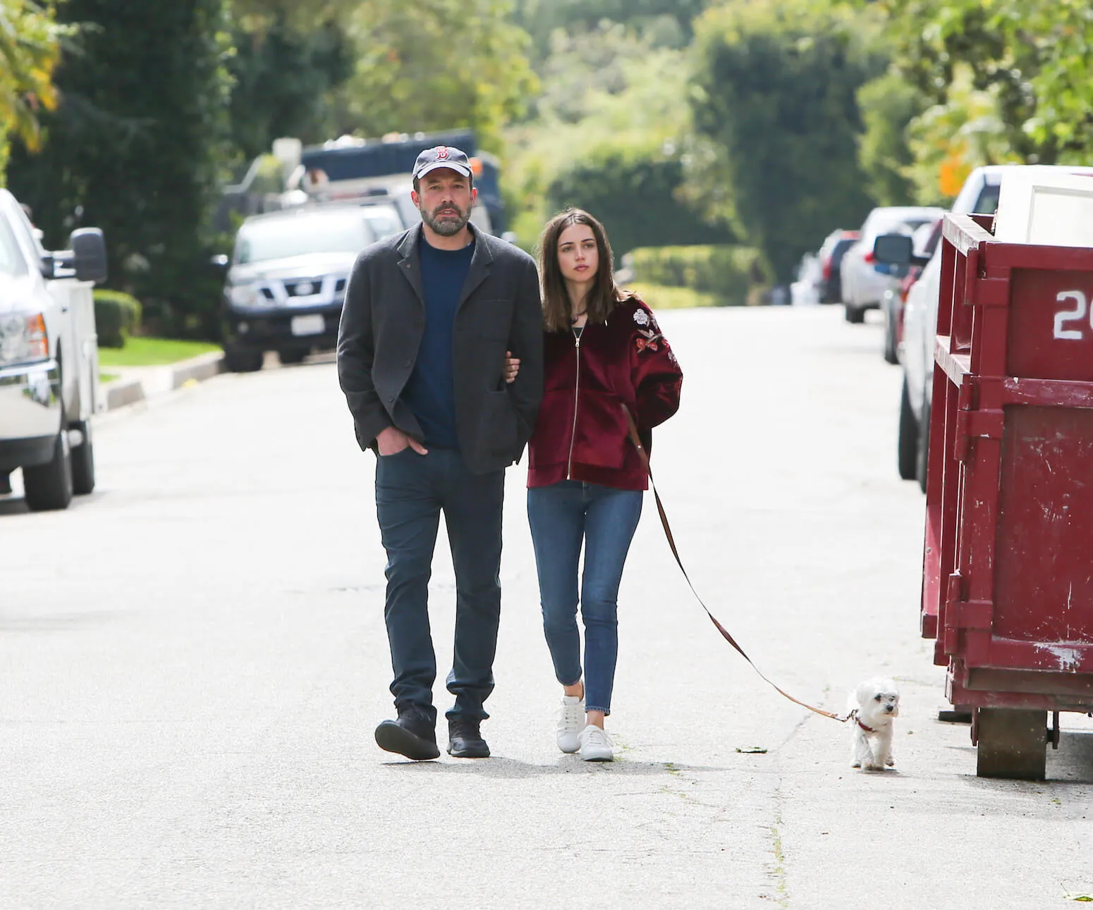 Ana de Armas and Ben Affleck walking arm-in-arm with her dog in Los Angeles in March 2020