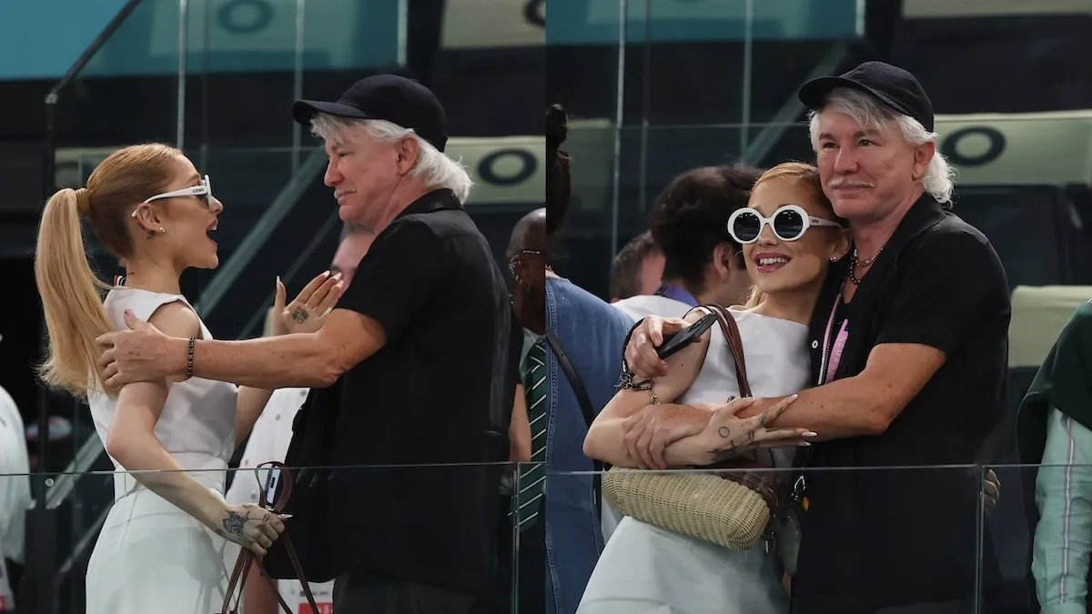 Wearing a white dress, Ariana Grande hugs Baz Luhrmann during the 2024 Summer Olympics