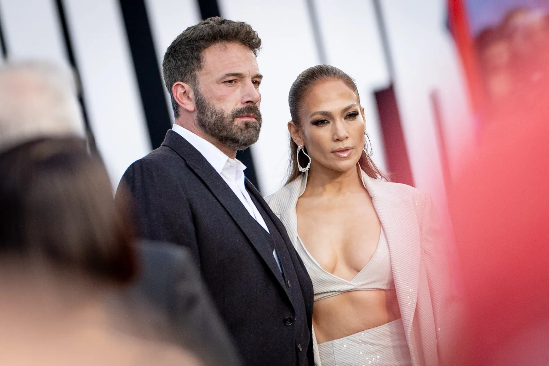 Ben Affleck and Jennifer Lopez posing together at a movie premiere in 2023