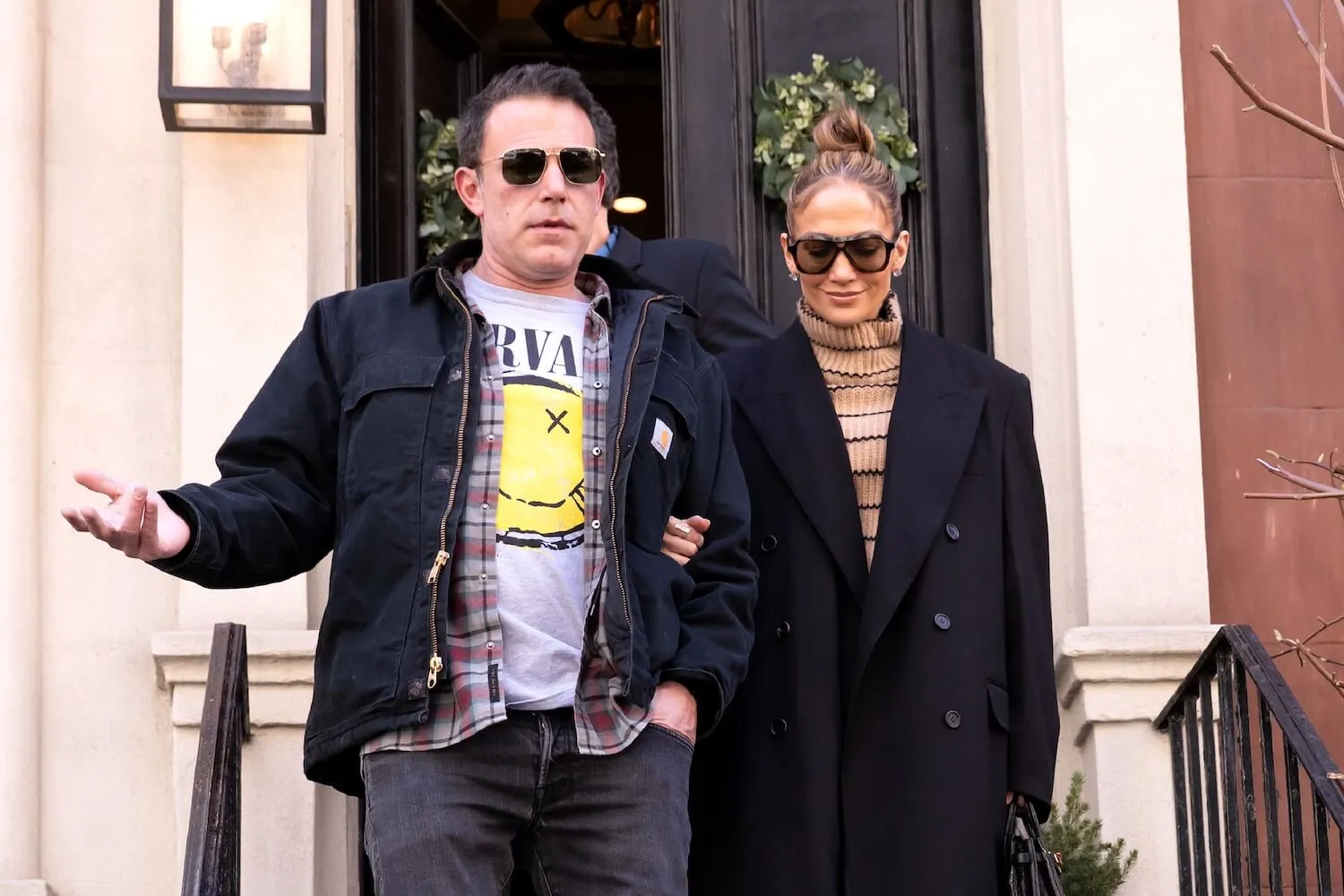 Ben Affleck and Jennifer Lopez walking arm in arm in New York City in March 2024