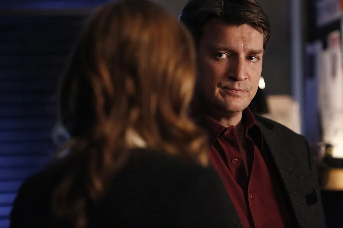 Nathan Fillion posing as his character Richard Castle in an episode of 'Castle'.