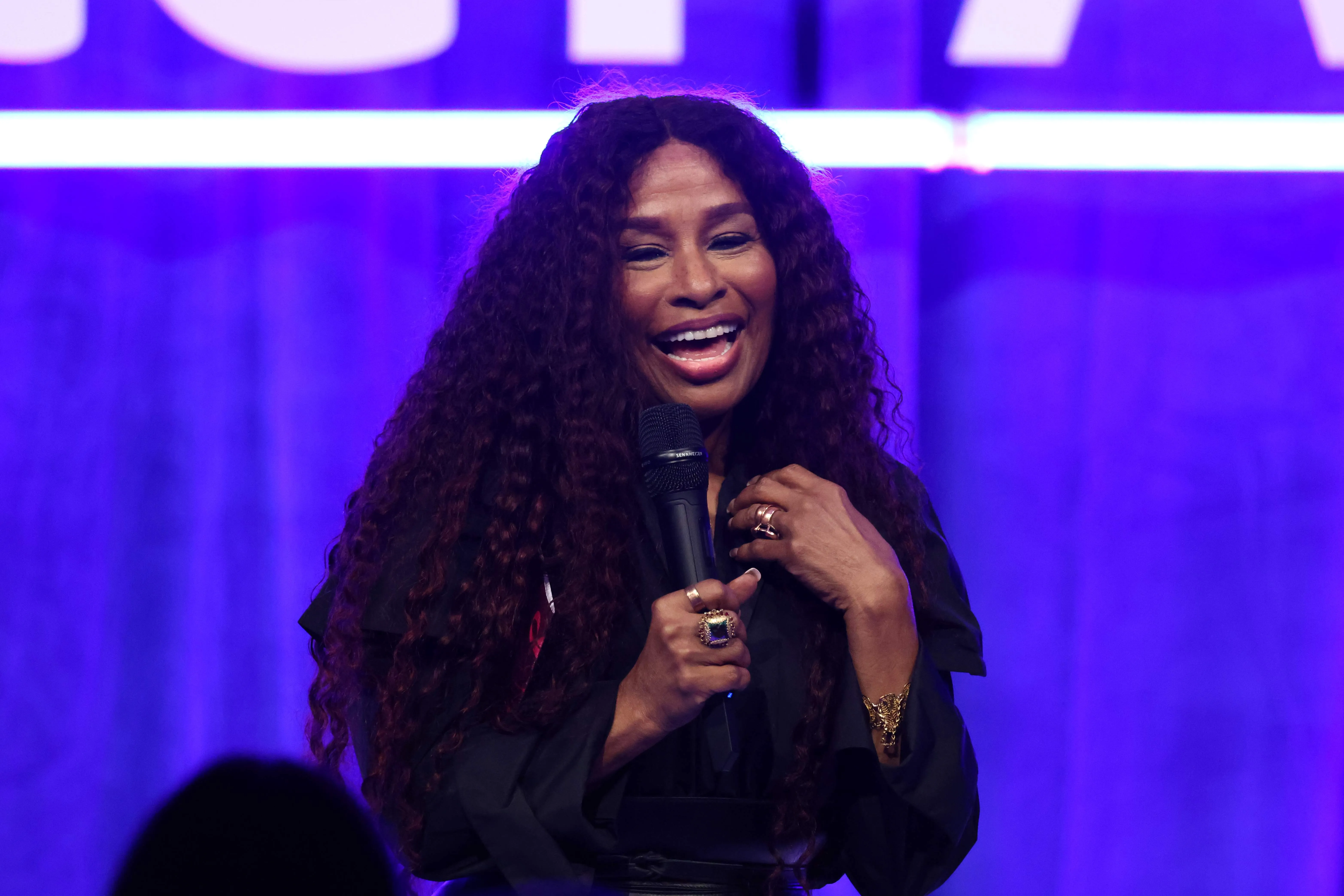 Wearing a black dress, Chaka Khan performs onstage during the Nordoff and Robbins O2 Silver Clef Awards 2024