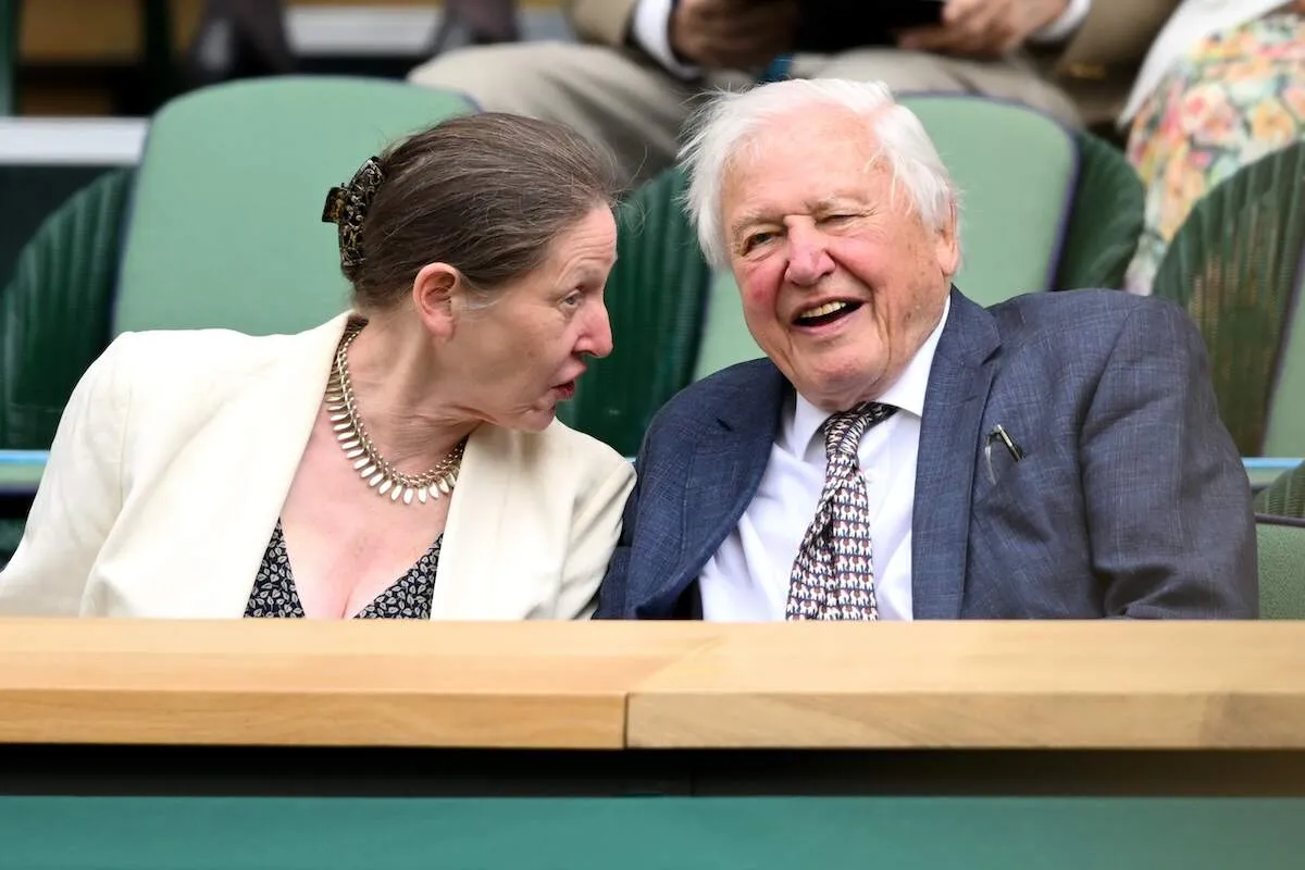 Environmentalist David Attenborough laughs during day one of the Wimbledon Tennis Championships