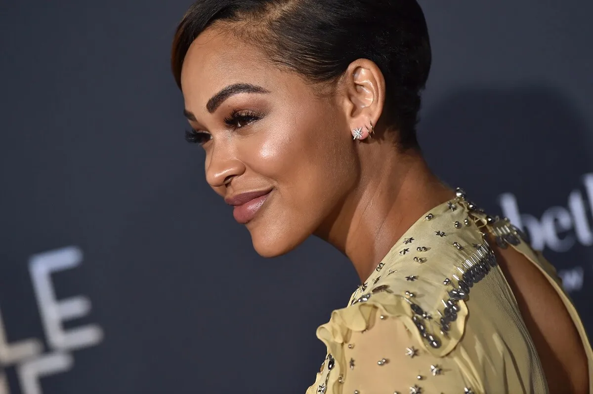 Meagan Good posing in a yellow dress at the premiere of Disney's 'A Wrinkle In Time'.