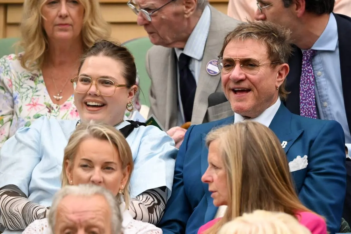 Simon Le Bon of Duran Duran laughs with his daughter Tallulah Le Bon at Wimbledon 2024