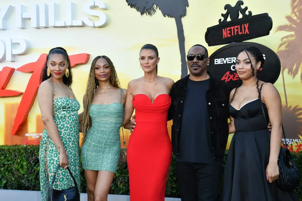 Eddie Murphy stands with his partner, Paige Butcher, and three of his daughters at the Beverly Hills Cop premiere