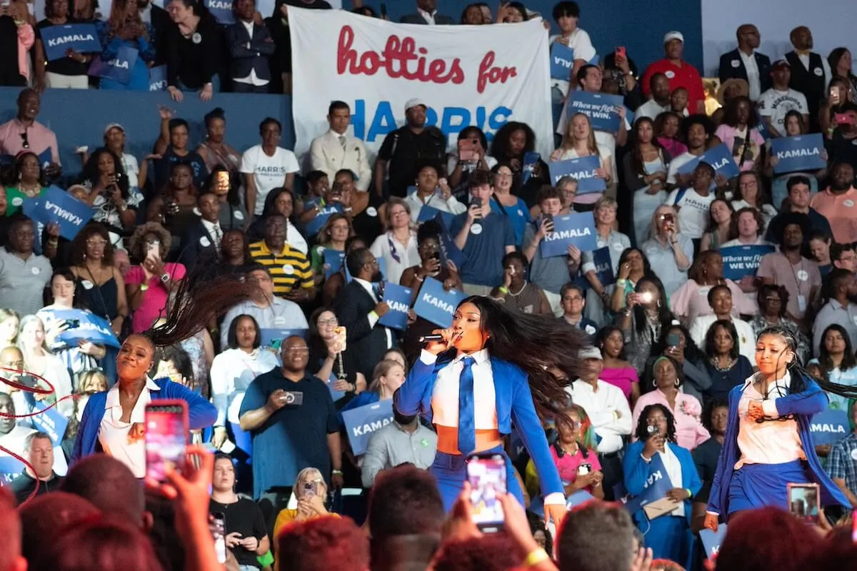 Megan Thee Stallion performs in front of a 'Hotties for Harris' sign