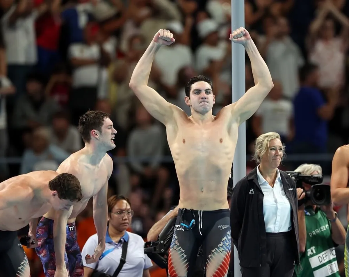 Jack Alexy and other members of Team USA Team celebrate after winning gold in the Men's 4x100m Freestyle Relay Final