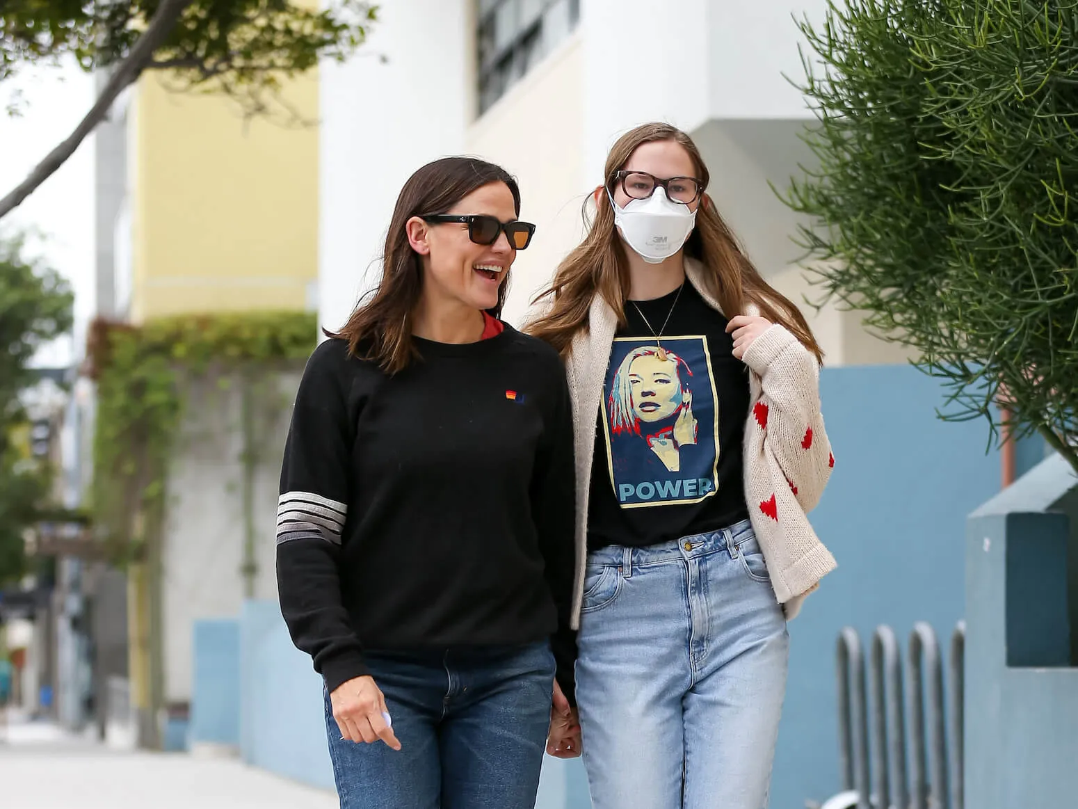 Jennifer Garner walking with Violet Affleck, who's wearing a mask, outside in Los Angeles in 2024