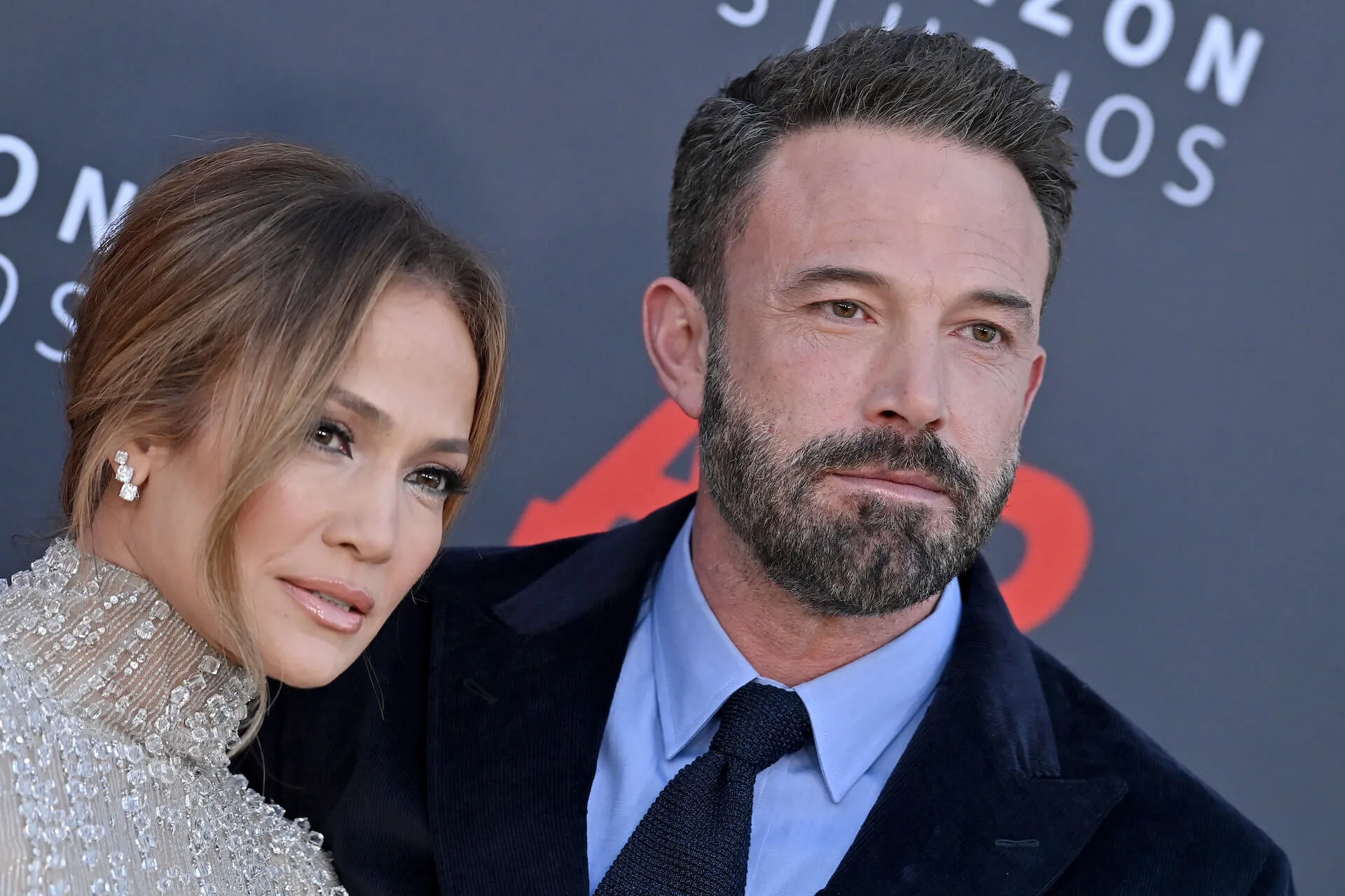 Jennifer Lopez and Ben Affleck standing next to each other and posing at the premiere of 'AIR' in March 2023