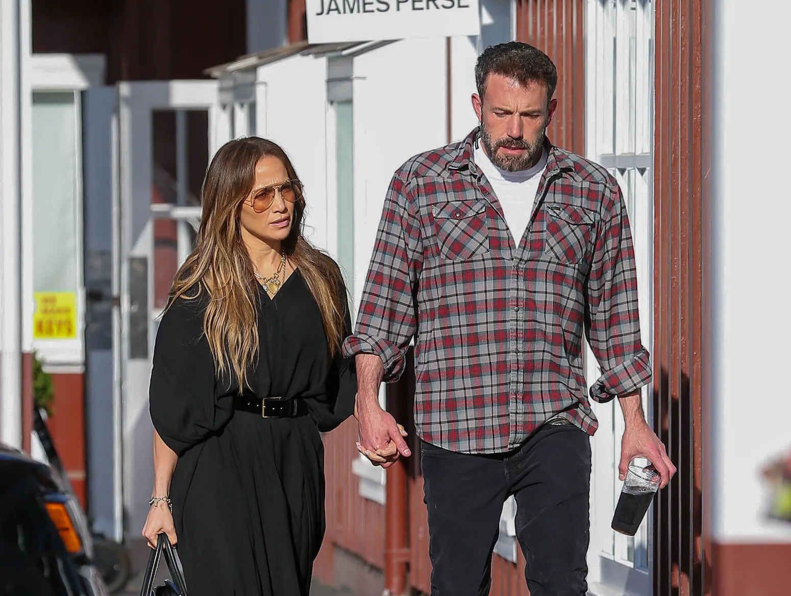 Jennifer Lopez and Ben Affleck holding hands and walking together in Los Angeles in 2022