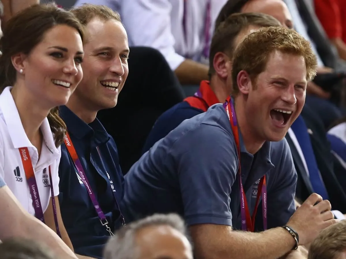 Kate Middleton, Prince William, and Prince Harry laugh as they watch the track cycling at the London 2012 Olympic Games