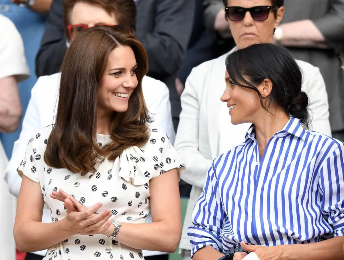 Kate Middleton and Meghan Markle attend the Wimbledon Tennis Championships