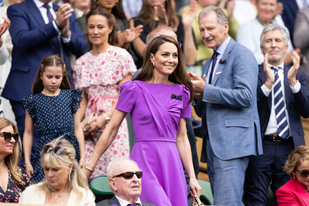 Kate Middleton at Wimbledon wearing a purple dress.