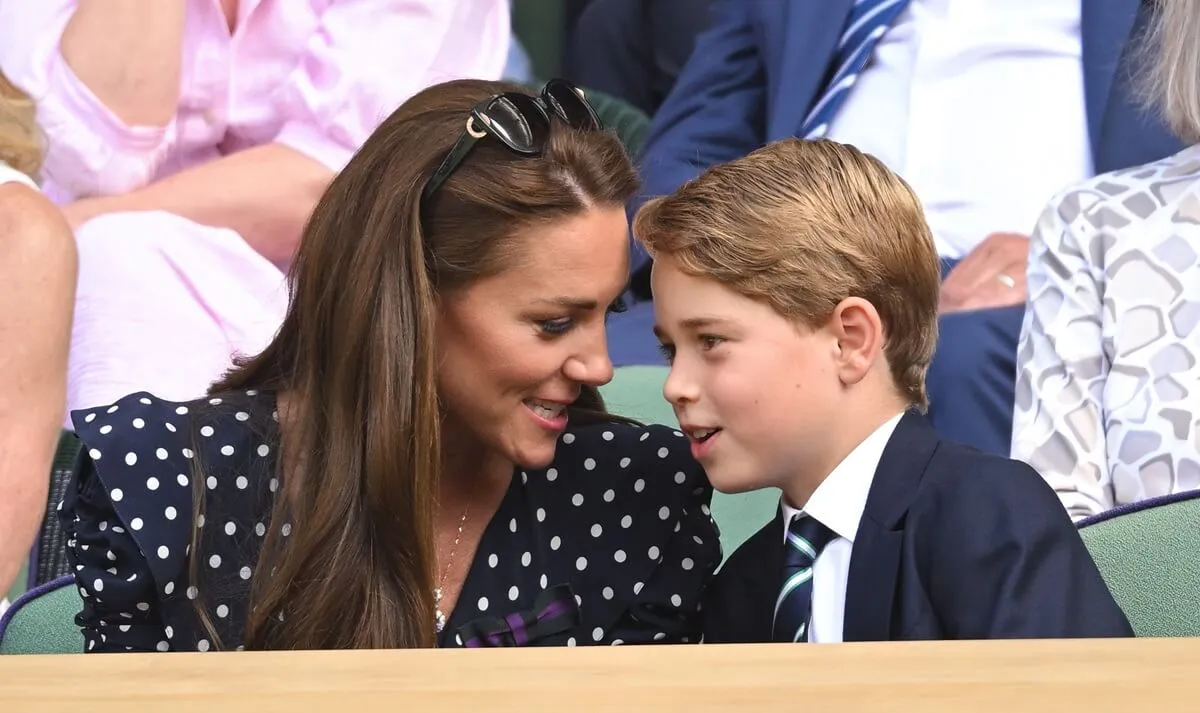 Kate Middleton talking to her son, Prince George, in the Royal Box at Wimbledon