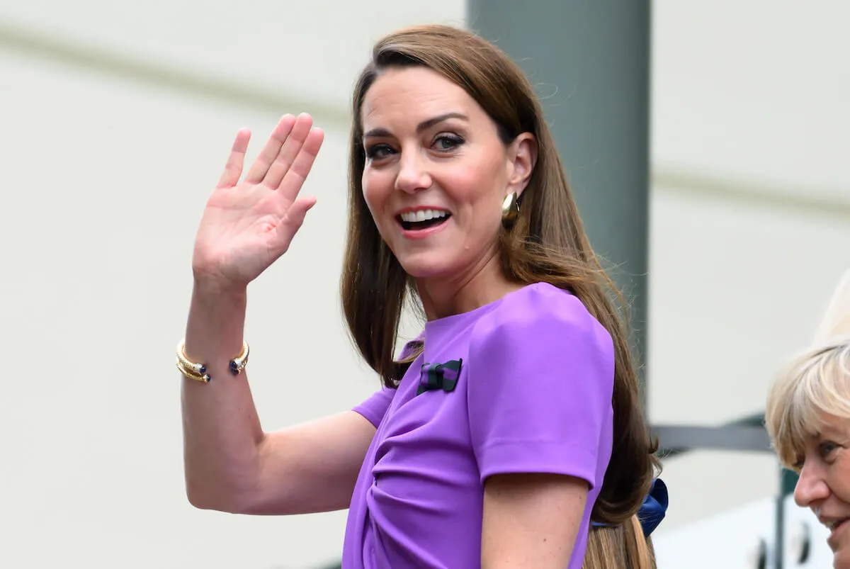 Kate Middleton, whose Wimbledon appearance was a 'little win' in her ongoing cancer battle, waves wearing a purple dress.