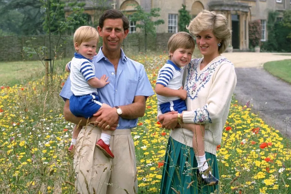 King Charles, who made a comment at Prince Harry's christening, stands with Princess Diana and their sons