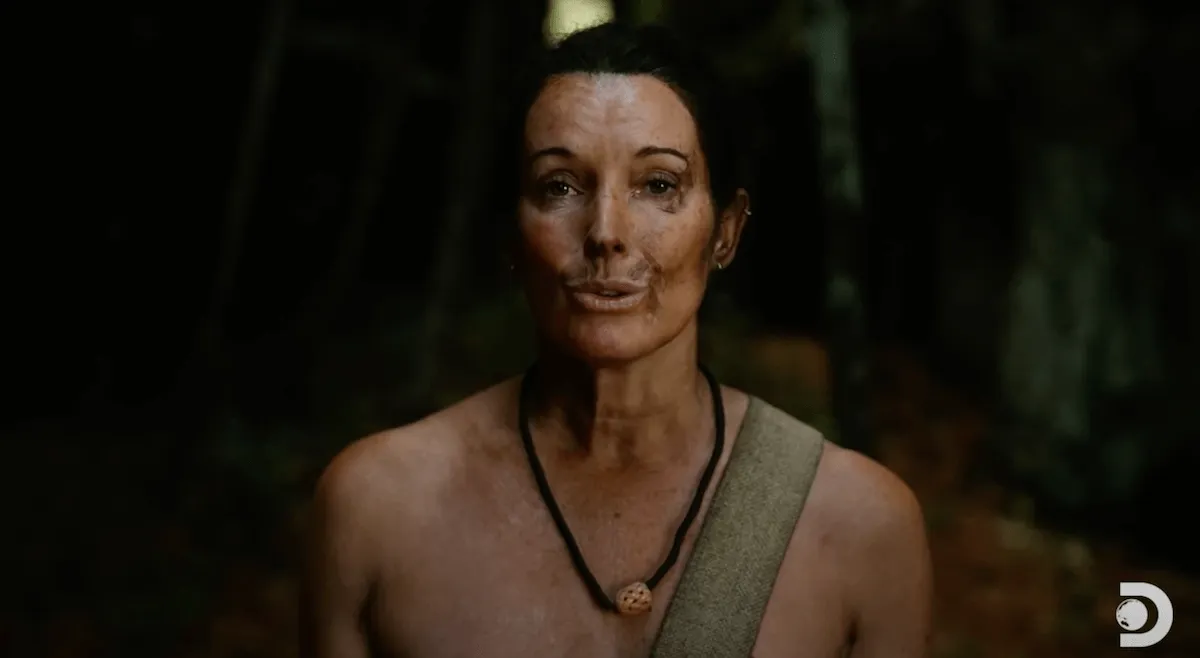 Ky Furneaux with mud on her face in an episode of 'Naked and Afraid'