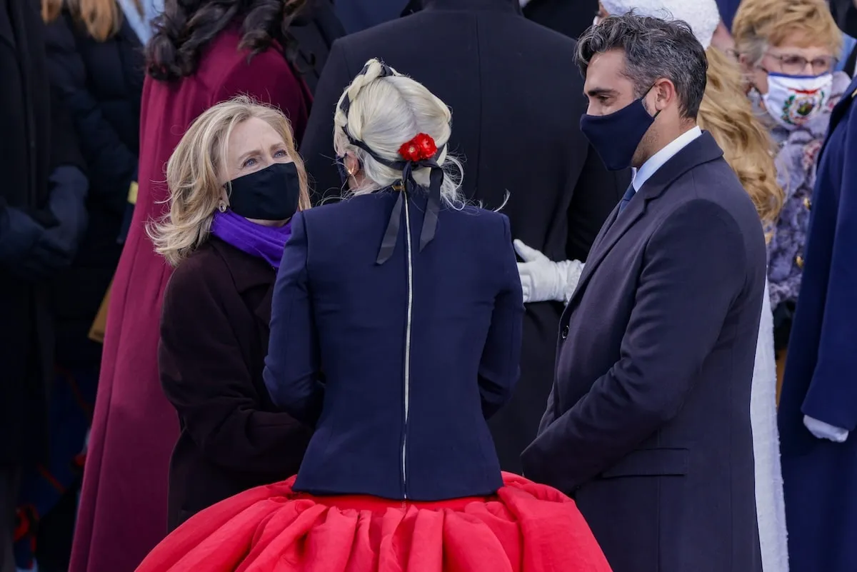 Singer Lady Gaga greets former Secretary of State Hillary Clinton during the inauguration of U.S. President Joe Biden