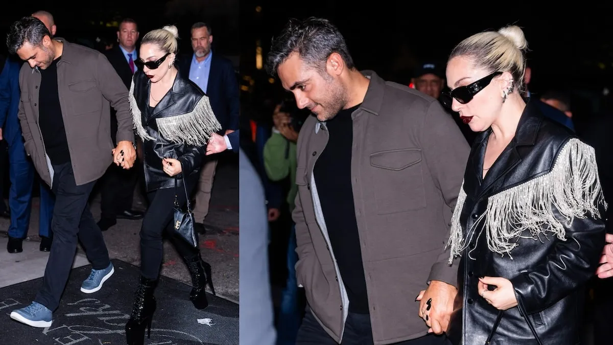 Couple Lady Gaga and Michael Polansky holds hands as they pass paparazzi in NYC