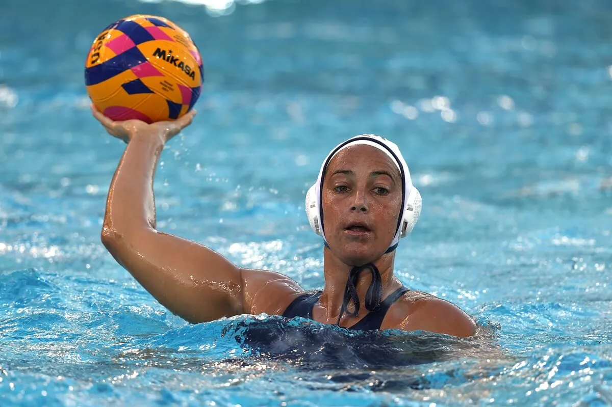 Maggie Steffens of the United States holds up the ball during a game against Italy