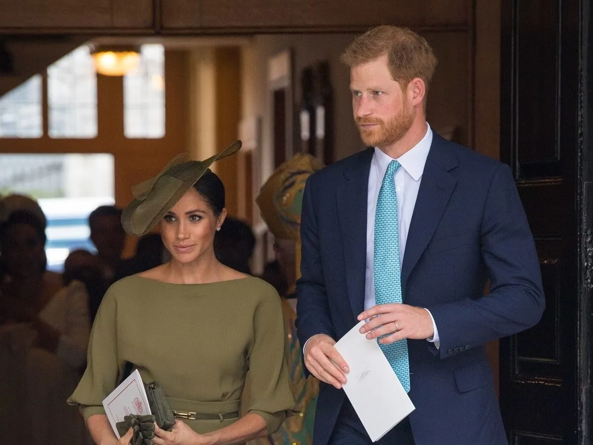 Meghan Markle and Prince Harry depart after attending Prince Louis' christening