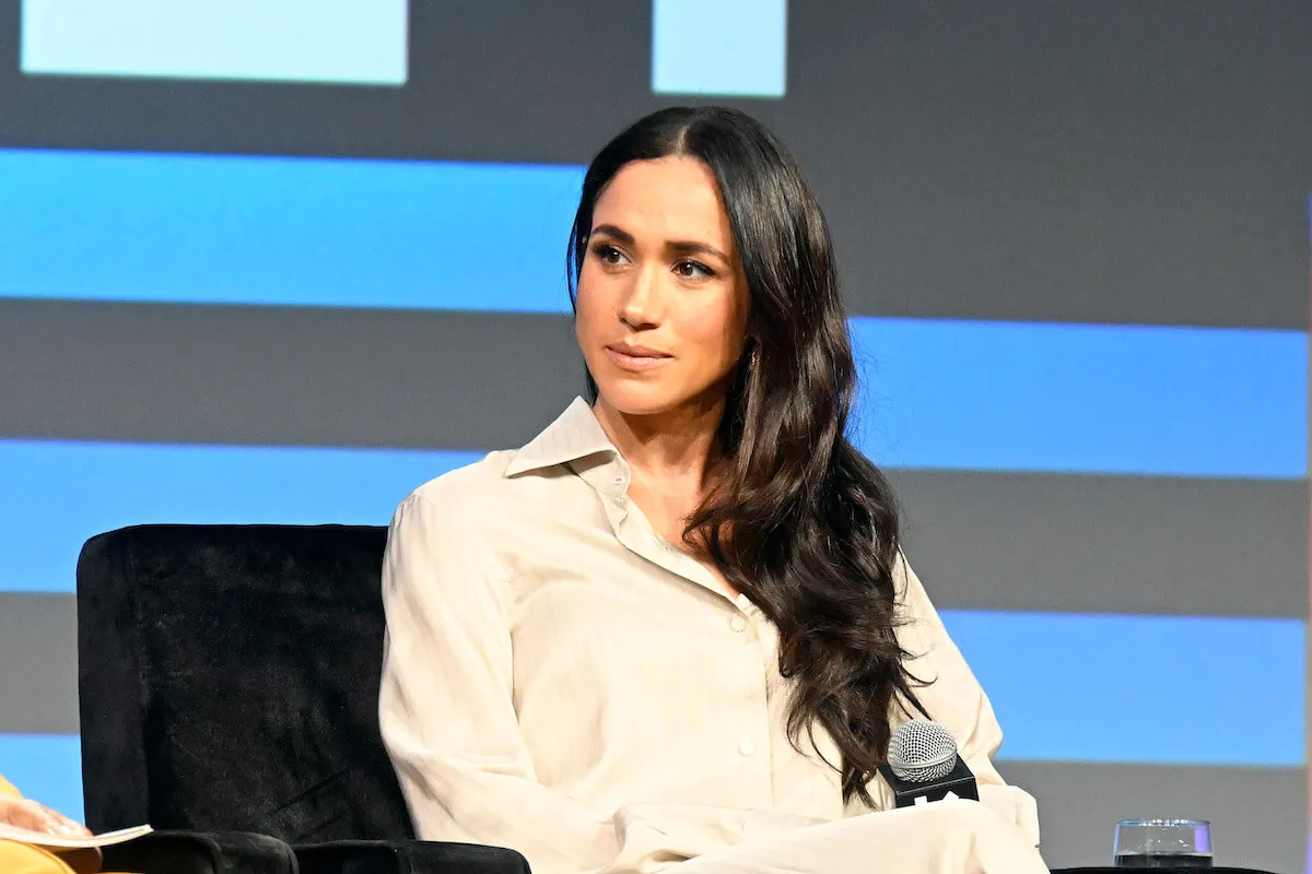 Meghan Markle, who can' repeat 'Archetypes' with Lemonada Media podcast,' looks on